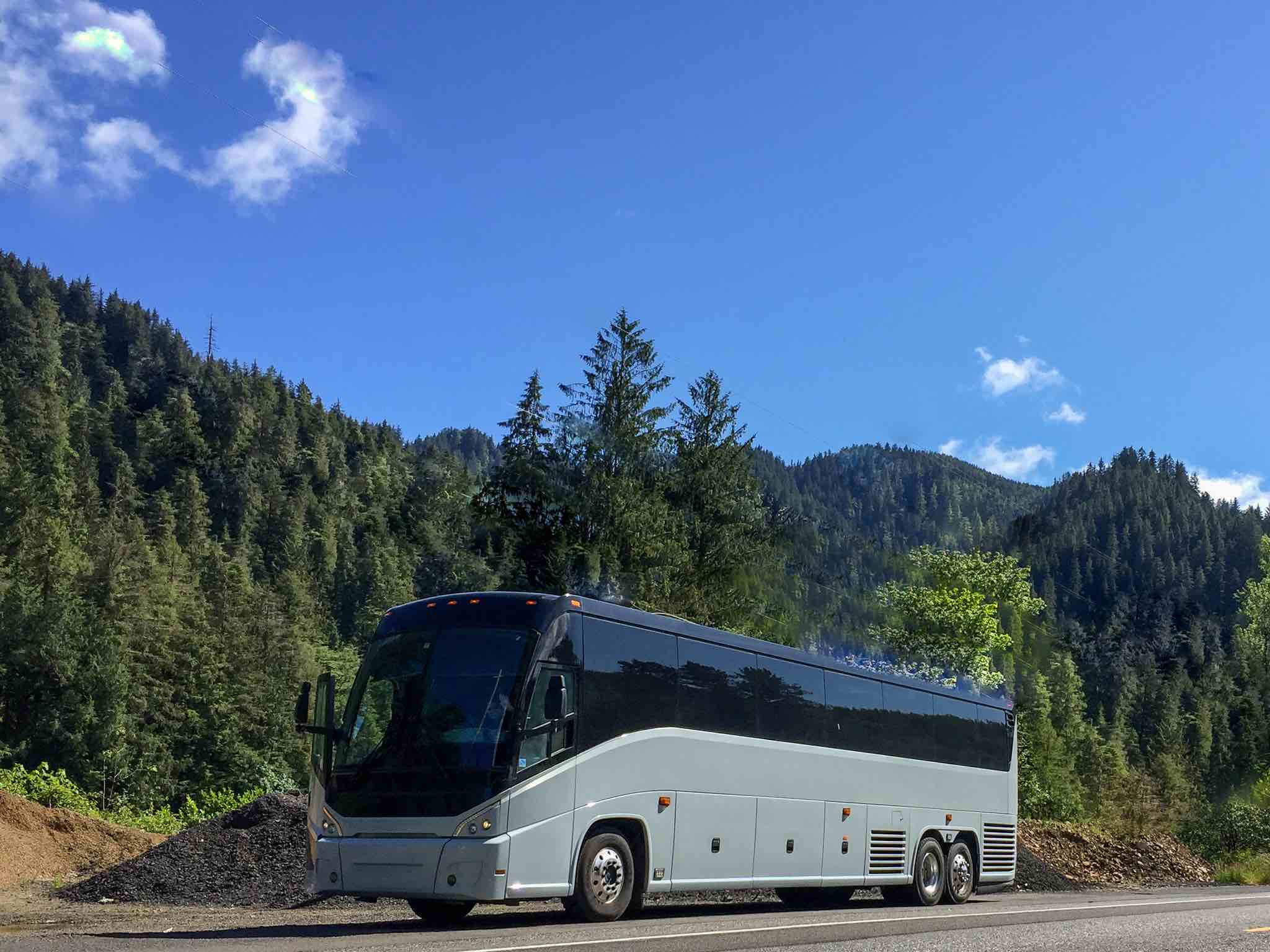 56-passenger Luxury Motorcoach on a scenic trip
