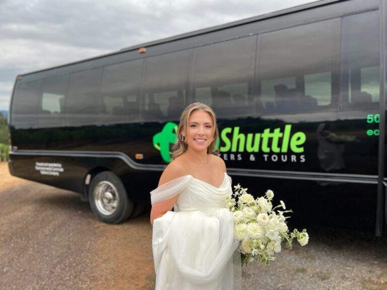 A bride exiting a charter bus for her wedding.