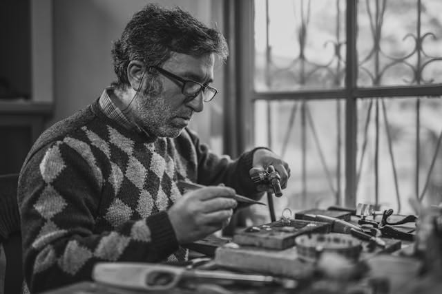 Man repairing electronics at home to reduce waste and support sustainable storage practices.